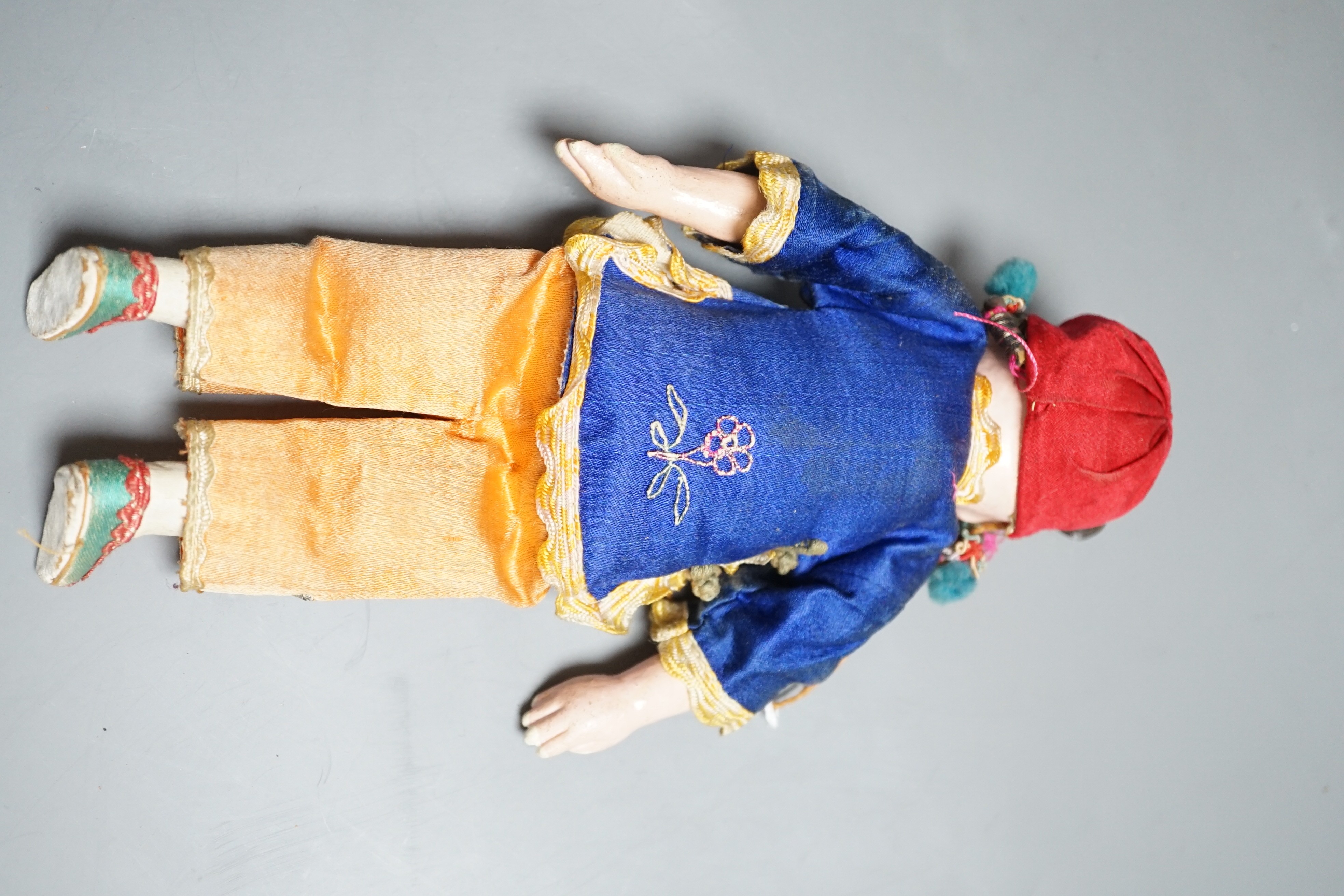 An early 20th century Chinese papier-mâché doll